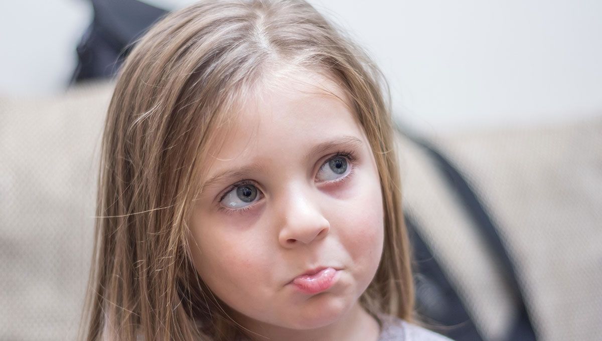 Blond girl with a sad face