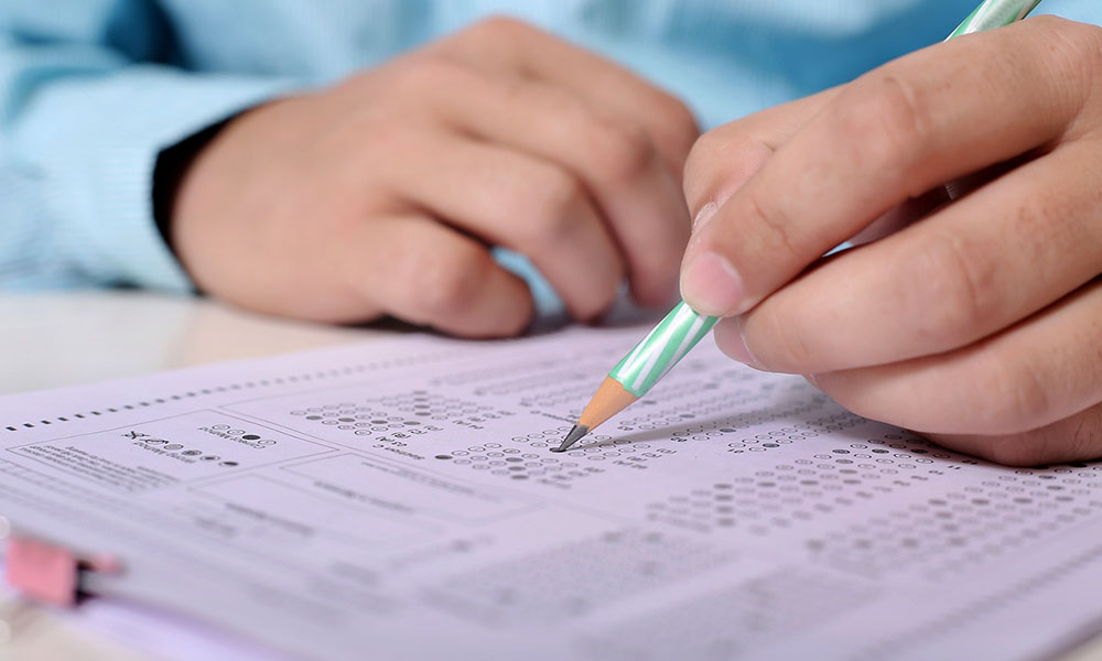 Boy marks answers on a test