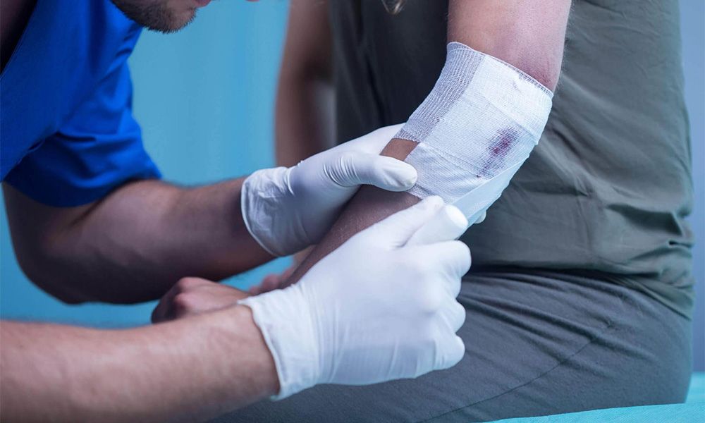 Doctor putting dressing a woman