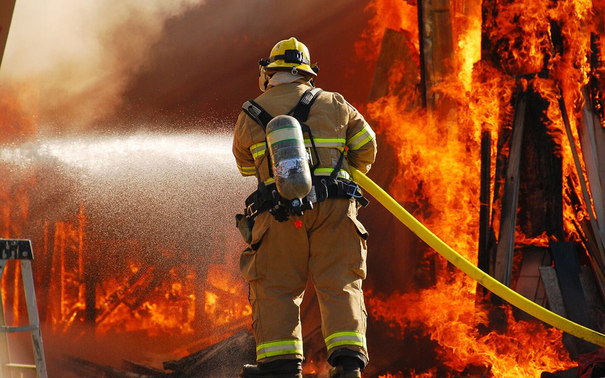 Firefighter extinguishing a fire