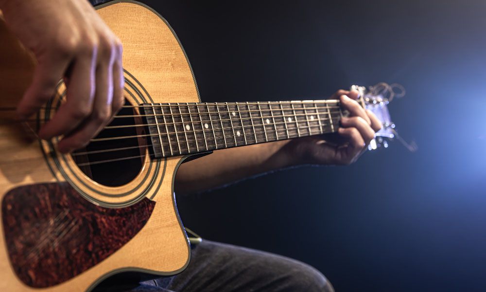 Man playing acoustic guitar
