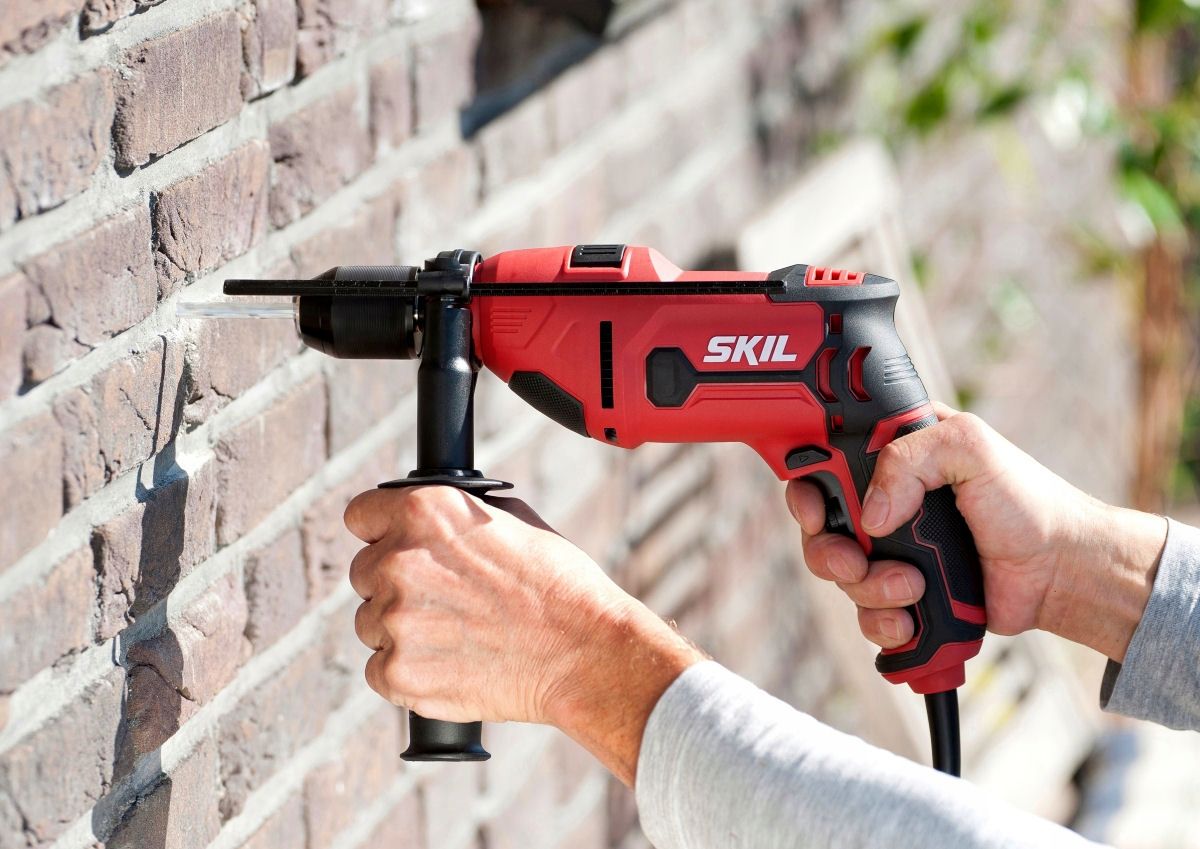 Man uses a drill