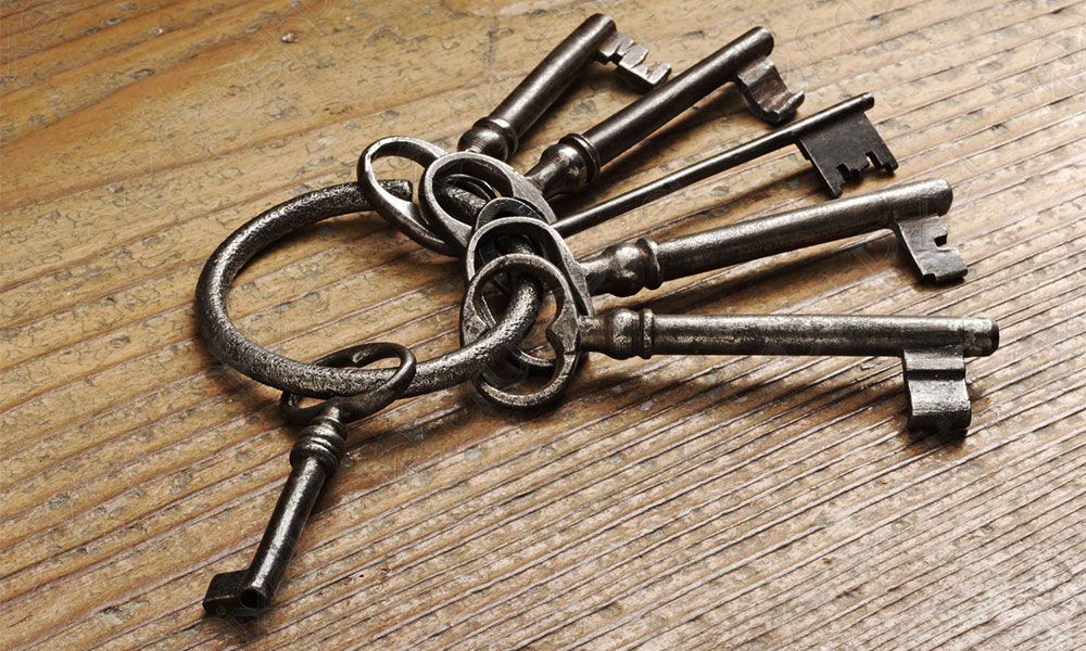 Old keys on wooden table