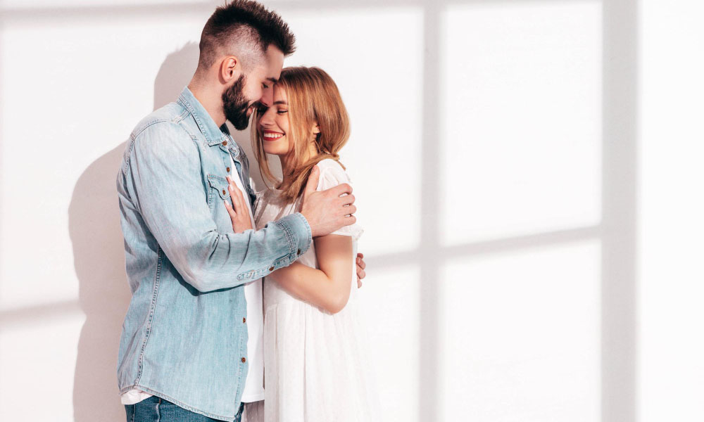 Smiling couple hugging