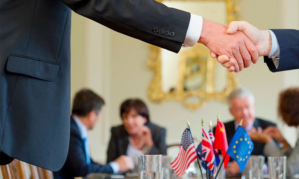 Two people shake hands